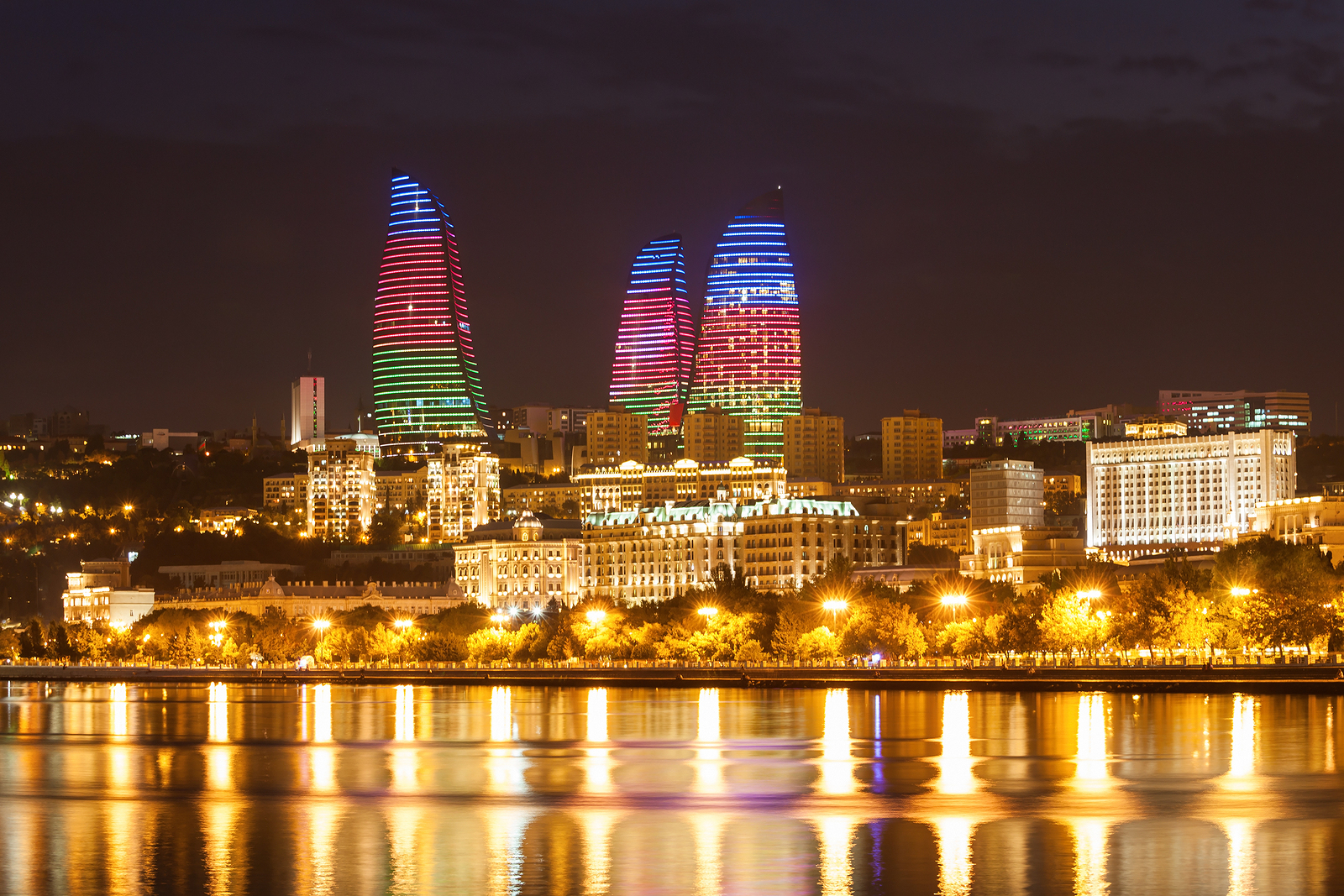 BAKU AZERBAIJAN - SEPTEMBER 15 2016: Baku Flame Towers at night. It is the tallest skyscraper in Baku Azerbaijan with a height of 190 meters.