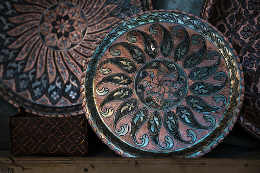 Copper plate handcrafted, traditionally made in Lagich, Azerbaijan. Handmade plate in souvenir shop